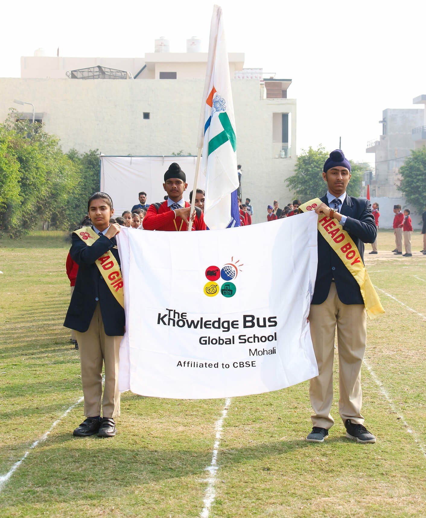 TKB students carrying the school flag at sports day